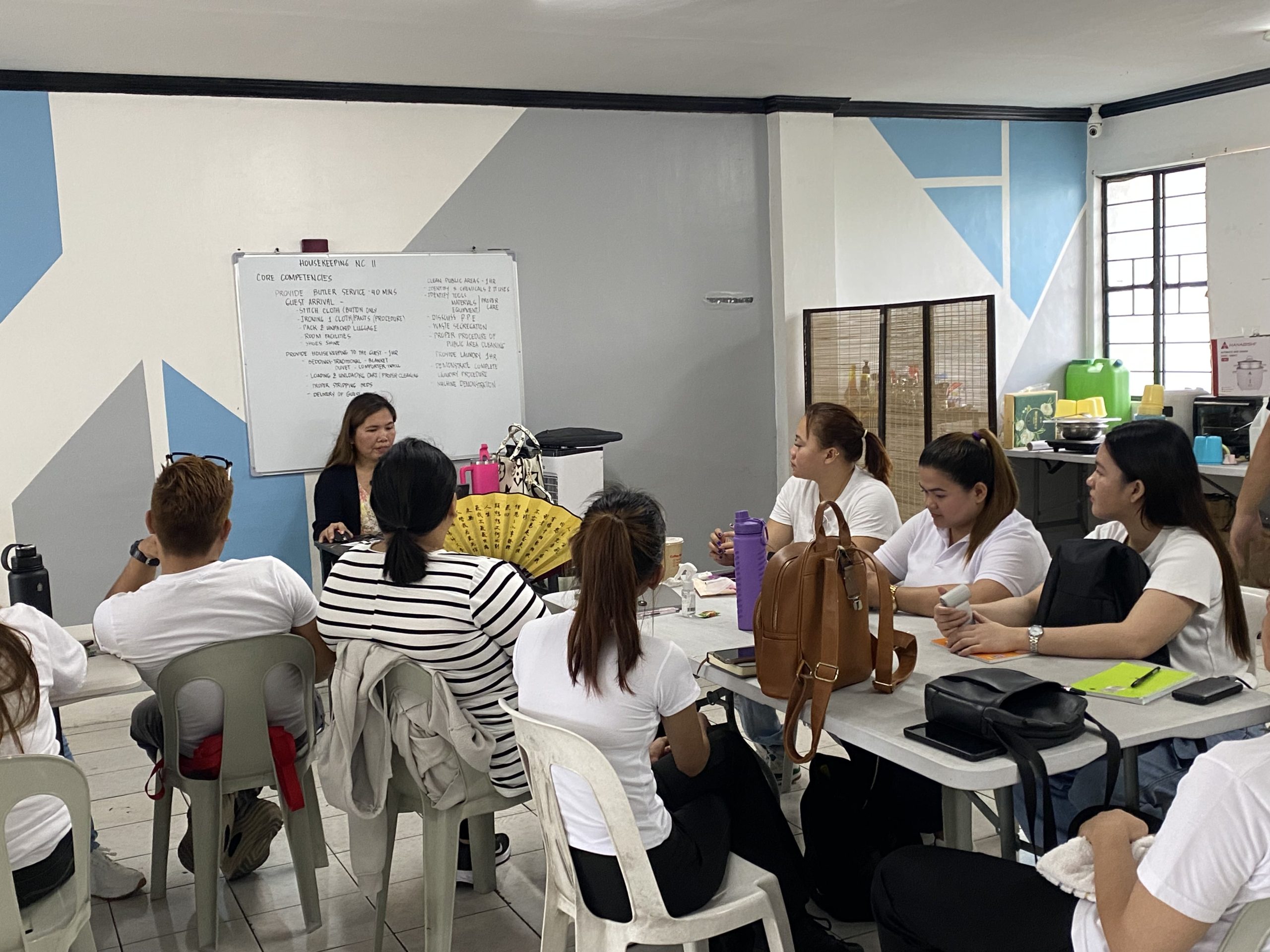 TESDA-certified instructors teaching housekeeping classes