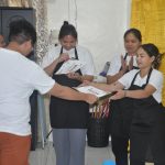 TESDA scholarship students in professional hotel uniforms
